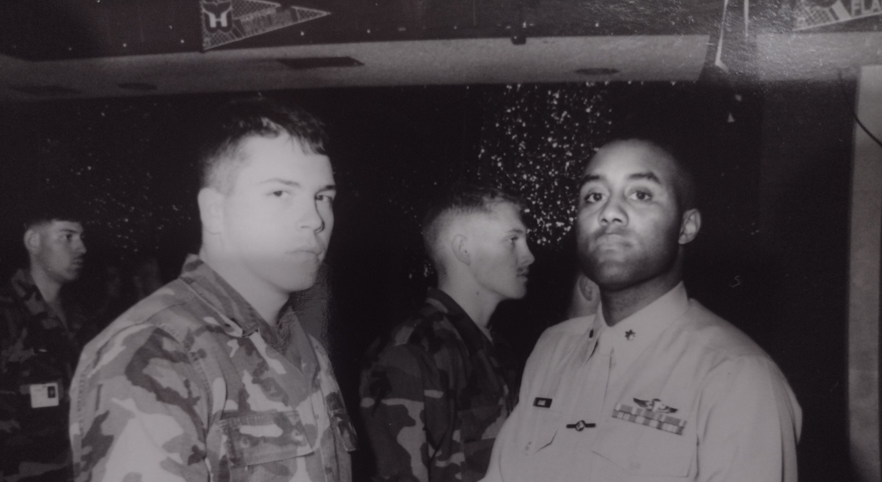 Black-and-white photo of two military men in uniform.