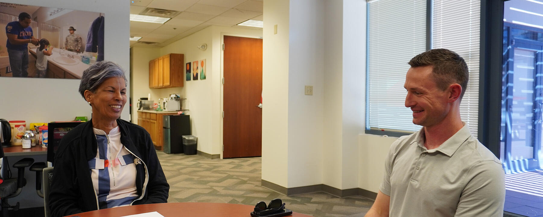 Brennan Walley and Wanda Wright, sitting and chatting in the Office for Veteran and Military Academic Engagement